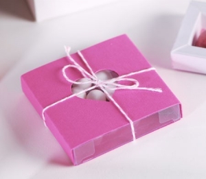 Romantic pink gift box with a cut-out heart