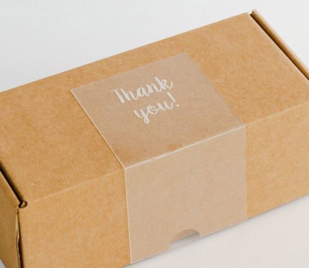 Transparent "Thank you" label for deliveries.